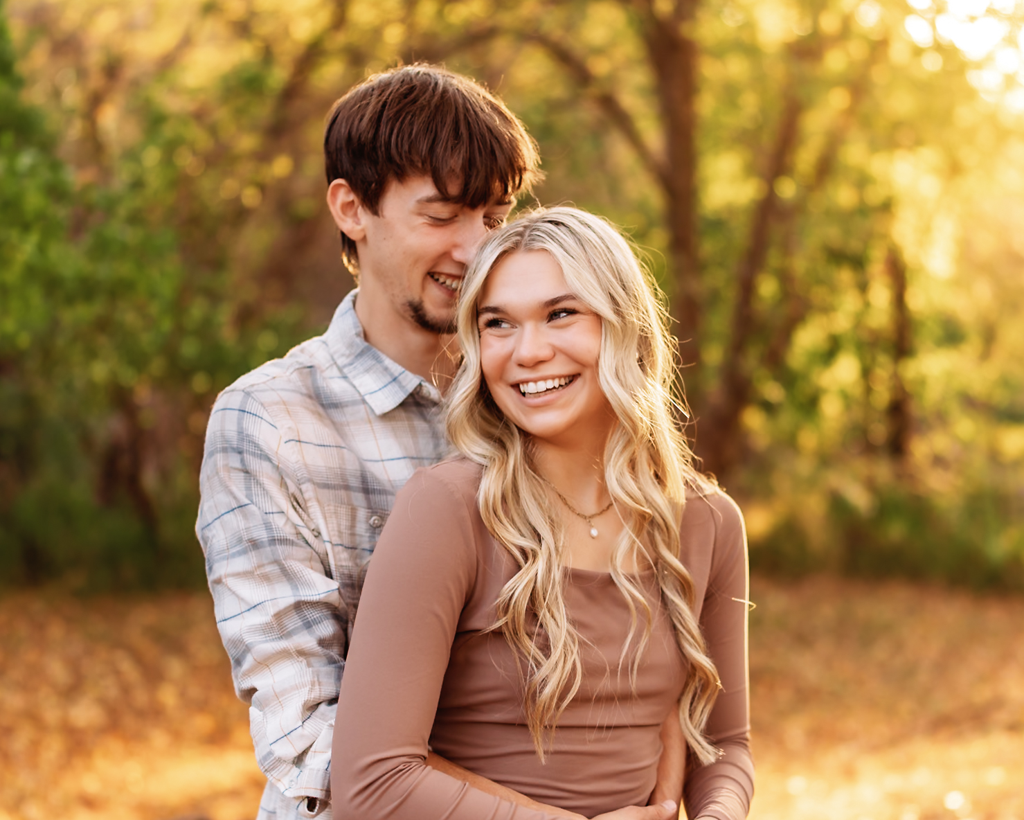 Ali & Jaden Engagement Photo - Jaden's arms around Ali, both laughing