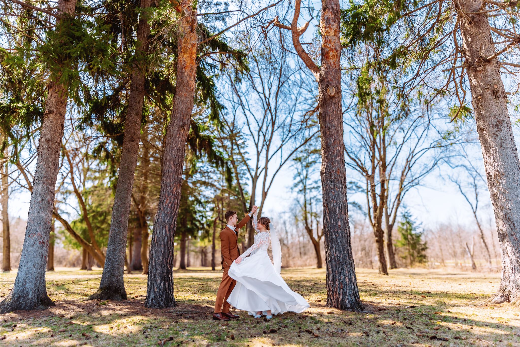 Courtney & Joel Green Bay Wedding Photo - Twirling her in dress