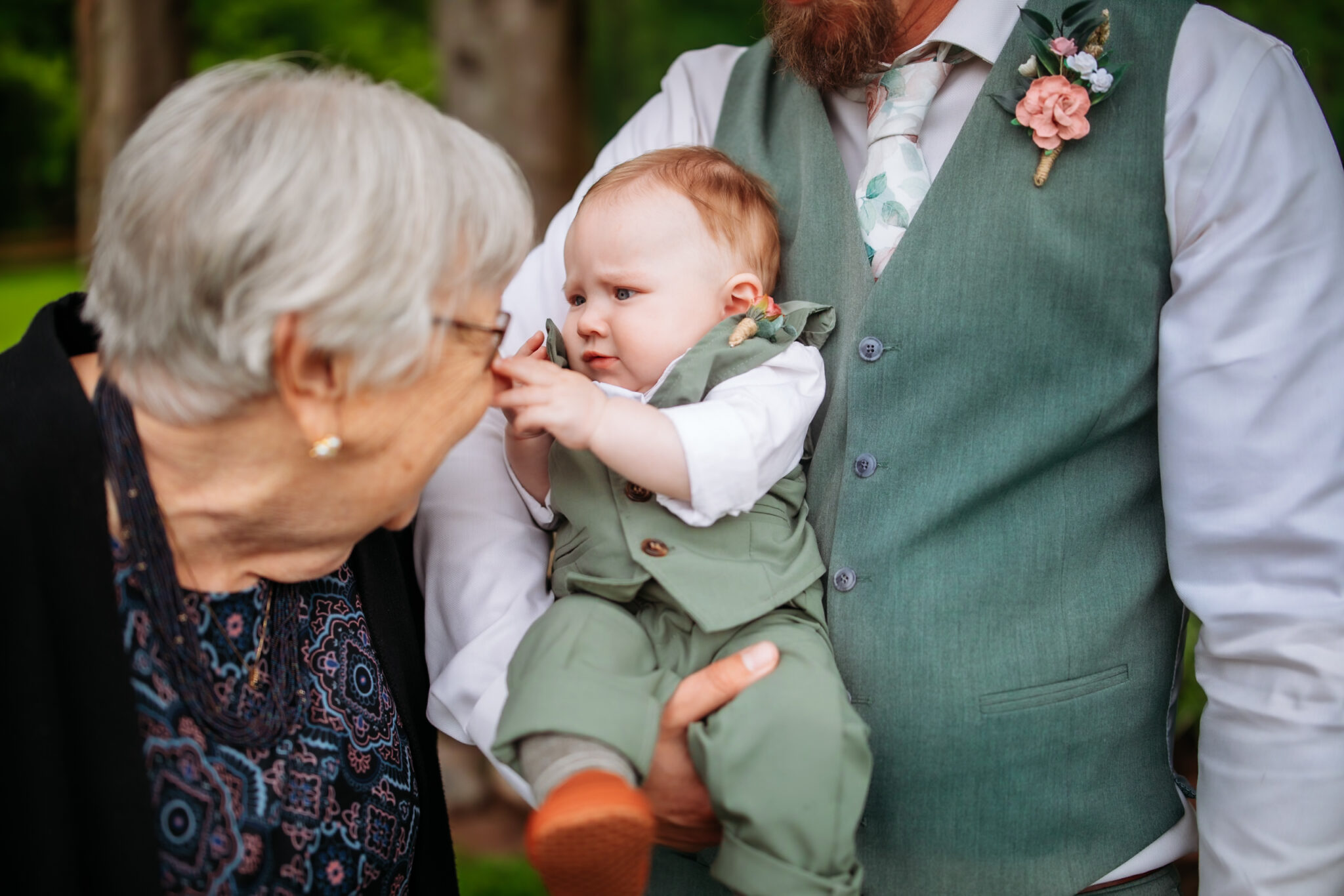 Grandma laughing at great-grandchild